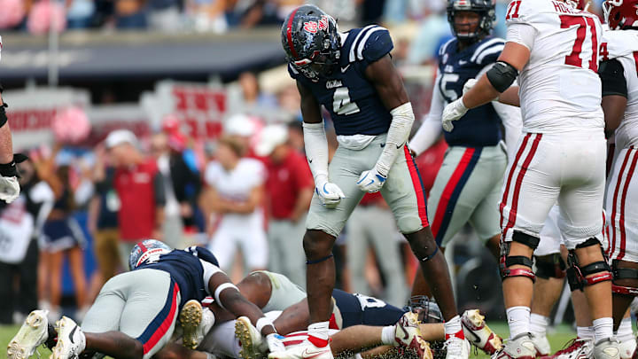 Oct 26, 2024; Oxford, Mississippi, USA; Mississippi Rebels linebacker Suntarine Perkins (4) reacts after a tackle during the second half against the Oklahoma Sooners at Vaught-Hemingway Stadium. Mandatory Credit: Petre Thomas-Imagn Images