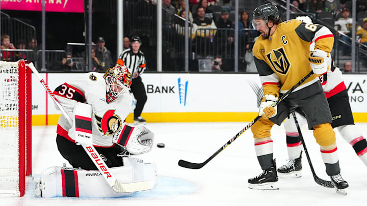 Nov 26, 2025; Las Vegas, Nevada, USA; Ottawa Senators goaltender Linus Ullmark (35) makes a save as Vegas Golden Knights right wing Mark Stone (61) attempts a deflection during the first period at T-Mobile Arena. Mandatory Credit: Stephen R. Sylvanie-Imagn Images