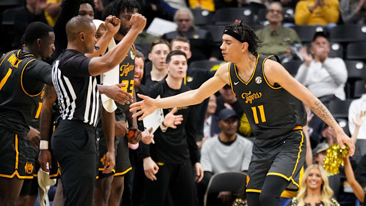Dec 14, 2024; Columbia, Missouri, USA; Missouri Tigers guard Trent Pierce (11) celebrates with team mates after scoring against the LIU Sharks during the second half at Mizzou Arena. Mandatory Credit: Denny Medley-Imagn Images