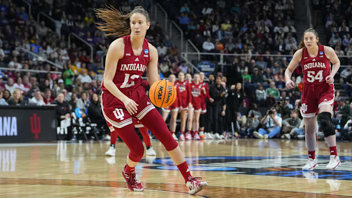 Indiana Hoosiers guard Yarden Garzon (12) dribbles the ball against the South Carolina Gamecocks during the first half in the semifinals of the Albany Regional of the 2024 NCAA Tournament at the MVP Arena at MVP Arena.