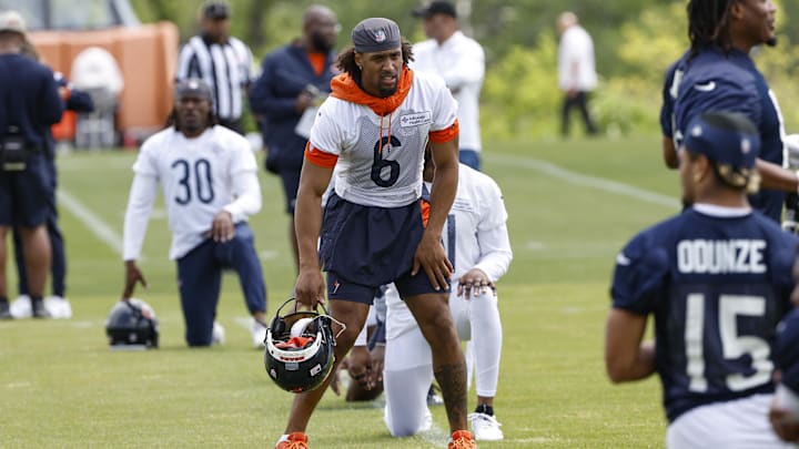 Kyler Gordon and the Bears begin their stretching routine prior to the start of their final minicamp practice. Kyler Gordon and the Bears begin their stretching routine prior to the start of their final minicamp practice.