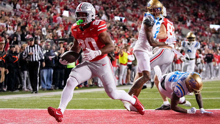 Ohio State Buckeyes running back James Peoples (20) runs for a touchdown during the NCAA football game against the UCLA Bruins at Ohio Stadium in Columbus on Nov. 15, 2025. Ohio State won 48-10.
