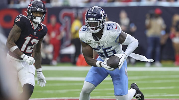 Nov 24, 2024; Houston, Texas, USA; Tennessee Titans linebacker Kenneth Murray Jr. (56) intercepts a pass during the third quarter against the Houston Texans at NRG Stadium. Mandatory Credit: Troy Taormina-Imagn Images