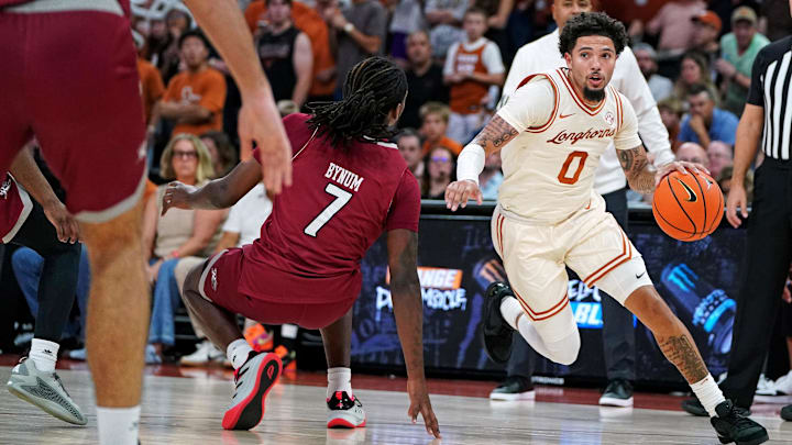 Texas Longhorns guard Jordan Pope (0) drives the ball to the basket against Rider Broncs forward Davis Bynim (7) during the first half at Moody Center. 