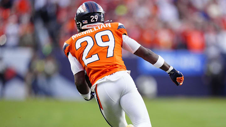 Nov 16, 2025; Denver, Colorado, USA; Denver Broncos cornerback Ja'Quan McMillian (29) returns an interception in the third quarter against the Kansas City Chiefs at Empower Field at Mile High. 