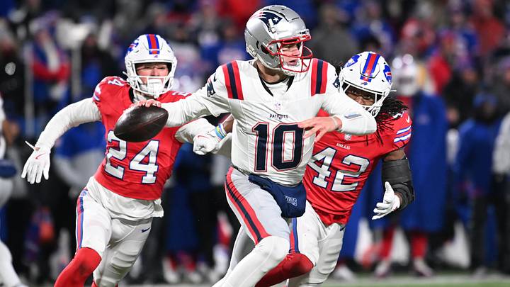 Dec. 22, 2024; Orchard Park, New York, USA; New England Patriots' quarterback Drake Maye (10) throws a pass while under pressure from Buffalo Bills' safety Cole Bishop (24) and linebacker Dorian Williams (42) in the fourth quarter at the old Highmark Stadium. Dec. 22, 2024; Orchard Park, New York, USA; New England Patriots' quarterback Drake Maye (10) throws a pass while under pressure from Buffalo Bills' safety Cole Bishop (24) and linebacker Dorian Williams (42) in the fourth quarter at the old Highmark Stadium.