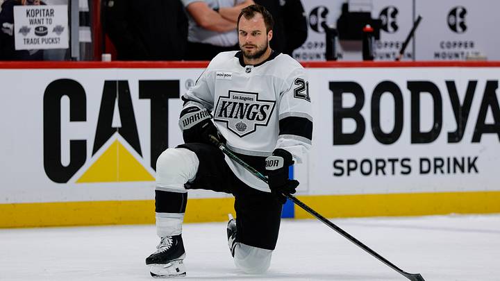 Apr 21, 2026; Denver, Colorado, USA; Los Angeles Kings center Scott Laughton (21) stretches before game two against the Colorado Avalanche of the first round of the 2026 Stanley Cup Playoffs at Ball Arena. Mandatory Credit: Isaiah J. Downing-Imagn Images