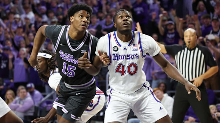 Jan 24, 2026; Manhattan, Kansas, USA; Kansas Jayhawks forward Flory Bidunga (40) and Kansas State Wildcats forward Taj Manning (15) fight for position during the first half at Bramlage Coliseum. Mandatory Credit: Scott Sewell-Imagn Images