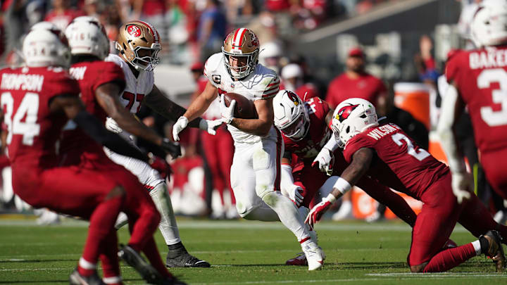 Sep 21, 2025; Santa Clara, California, USA; San Francisco 49ers running back Christian McCaffrey (23) carries the ball against the Arizona Cardinals during the second half at Levi's Stadium. Mandatory Credit: Cary Edmondson-Imagn Images