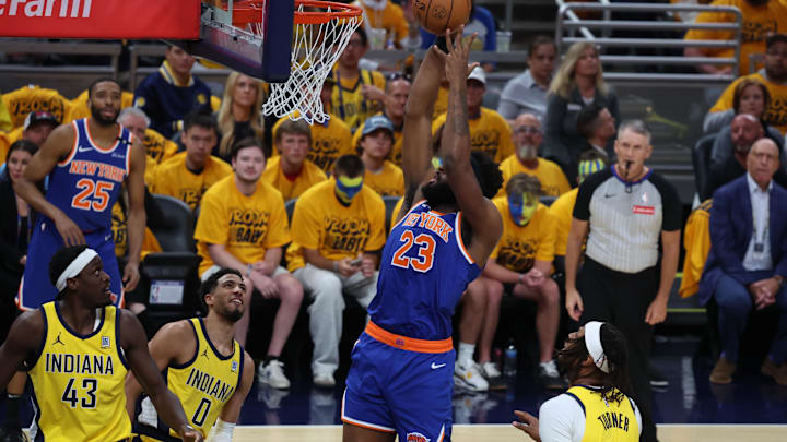 May 25, 2025; Indianapolis, Indiana, USA; New York Knicks center Mitchell Robinson (23) shoots a layup over Indiana Pacers center Myles Turner (33), forward Pascal Siakam (43) and guard Tyrese Haliburton (0) during the first quarter of game three of the eastern conference finals for the 2025 NBA Playoffs at Gainbridge Fieldhouse. Mandatory Credit: Trevor Ruszkowski-Imagn Images May 25, 2025; Indianapolis, Indiana, USA; New York Knicks center Mitchell Robinson (23) shoots a layup over Indiana Pacers center Myles Turner (33), forward Pascal Siakam (43) and guard Tyrese Haliburton (0) during the first quarter of game three of the eastern conference finals for the 2025 NBA Playoffs at Gainbridge Fieldhouse. Mandatory Credit: Trevor Ruszkowski-Imagn Images