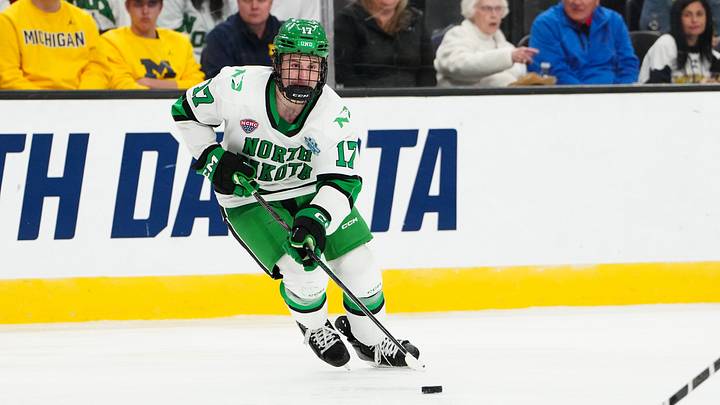 Apr 9, 2026; Las Vegas, Nevada, UNITED STATES; North Dakota Fighting Hawks forward Cole Reschny (17) moves the puck in the third period against the Wisconsin Badgers in the semifinals of the NCAA men's ice hockey Frozen Four at T-Mobile Arena. Mandatory Credit: Stephen R. Sylvanie-Imagn Images Apr 9, 2026; Las Vegas, Nevada, UNITED STATES; North Dakota Fighting Hawks forward Cole Reschny (17) moves the puck in the third period against the Wisconsin Badgers in the semifinals of the NCAA men's ice hockey Frozen Four at T-Mobile Arena. Mandatory Credit: Stephen R. Sylvanie-Imagn Images