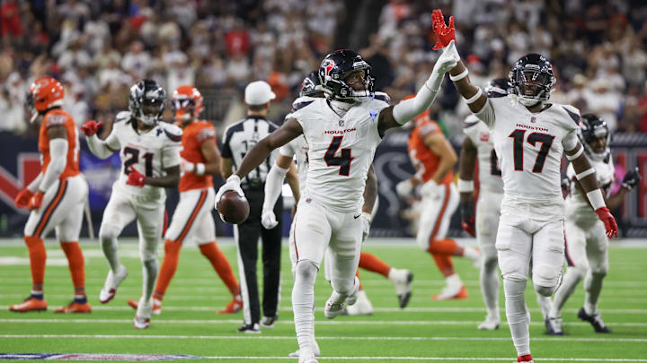 Sep 15, 2024; Houston, Texas, USA; Houston Texans cornerback Kamari Lassiter (4) celebrates his interception against the Chicago Bears in the second half at NRG Stadium. Mandatory Credit: Thomas Shea-Imagn Images Sep 15, 2024; Houston, Texas, USA; Houston Texans cornerback Kamari Lassiter (4) celebrates his interception against the Chicago Bears in the second half at NRG Stadium. Mandatory Credit: Thomas Shea-Imagn Images