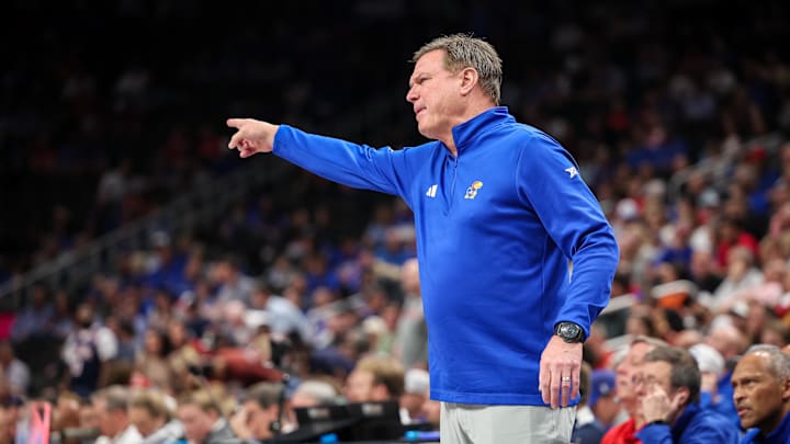 Mar 13, 2025; Kansas City, MO, USA; Kansas Jayhawks coach Bill Self reacts to game play during the second half against the Arizona Wildcats at T-Mobile Center. Mandatory Credit: William Purnell-Imagn Images Mar 13, 2025; Kansas City, MO, USA; Kansas Jayhawks coach Bill Self reacts to game play during the second half against the Arizona Wildcats at T-Mobile Center. Mandatory Credit: William Purnell-Imagn Images