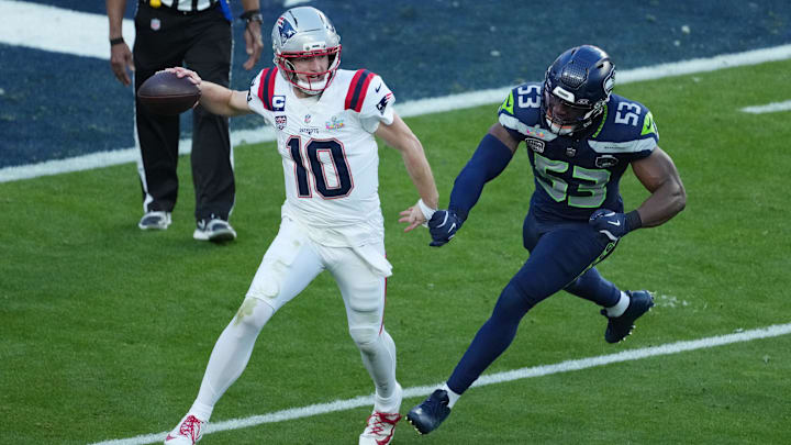 Feb 8, 2026; Santa Clara, CA, USA;  New England Patriots quarterback Drake Maye (10) is pressured by Seattle Seahawks linebacker Boye Mafe (53) in the first half in Super Bowl LX at Levi's Stadium. Mandatory Credit: Kirby Lee-Imagn Images