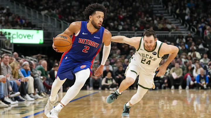 Nov 13, 2024; Milwaukee, Wisconsin, USA;  Detroit Pistons guard Cade Cunningham (2) drives for the basket in front of Milwaukee Bucks guard Pat Connaughton (24) during the third quarter at Fiserv Forum. Mandatory Credit: Jeff Hanisch-Imagn Images