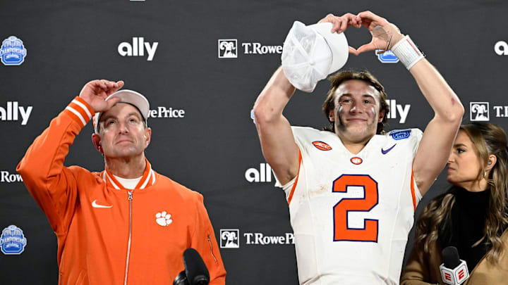 Dec 7, 2024; Charlotte, NC, USA; Clemson Tigers head coach Dabo Swinney, and quarterback Cade Klubnik (2) celebrate after winning the 2024 ACC Championship game against the Southern Methodist Mustangs at Bank of America Stadium. Mandatory Credit: Bob Donnan-Imagn Images Dec 7, 2024; Charlotte, NC, USA; Clemson Tigers head coach Dabo Swinney, and quarterback Cade Klubnik (2) celebrate after winning the 2024 ACC Championship game against the Southern Methodist Mustangs at Bank of America Stadium. Mandatory Credit: Bob Donnan-Imagn Images