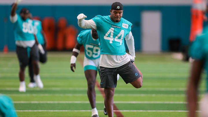 Miami Dolphins linebacker Chop Robinson (44) stretches during mandatory minicamp at Hard Rock Stadium.