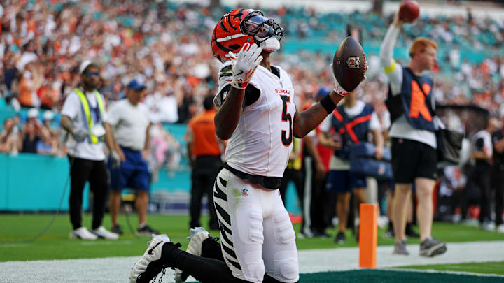 Dec 21, 2025; Miami Gardens, Florida, USA; Cincinnati Bengals wide receiver Tee Higgins (5) scores a touchdown during the second quarter against the Miami Dolphins at Hard Rock Stadium. Mandatory Credit: Nathan Ray Seebeck-Imagn Images