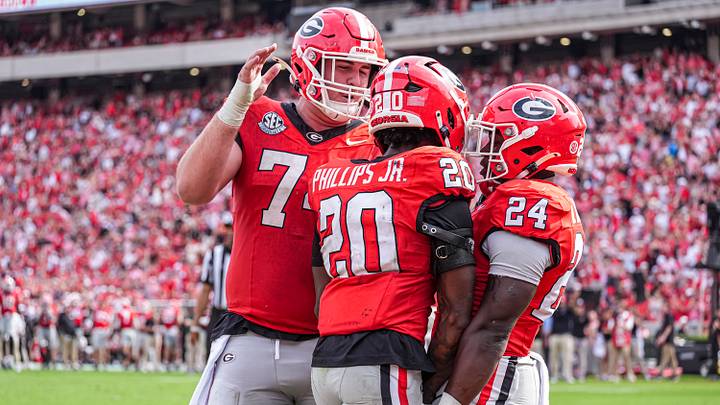 Oct 3, 2026; Athens, Georgia, USA; Georgia Bulldogs running back Dwight Phillips Jr. (20) reacts with offensive lineman Drew Bobo (74) and running back Bo Walker (24) after scoring a touchdown against the Vanderbilt Commodores at Sanford Stadium. Mandatory Credit: Dale Zanine-Imagn Images Oct 3, 2026; Athens, Georgia, USA; Georgia Bulldogs running back Dwight Phillips Jr. (20) reacts with offensive lineman Drew Bobo (74) and running back Bo Walker (24) after scoring a touchdown against the Vanderbilt Commodores at Sanford Stadium. Mandatory Credit: Dale Zanine-Imagn Images
