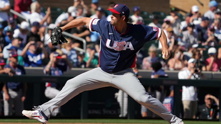 Mar 4, 2026; Scottsdale, AZ, USA; United States pitcher Clayton Kershaw (22) throws against the Colorado Rockies in the third inning at Salt River Fields. Mandatory Credit: Rick Scuteri-Imagn Images