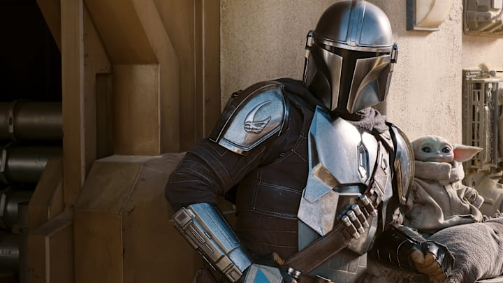The Mandalorian (Pedro Pascal) and the Child in THE MANDALORIAN, season two, exclusively on Disney+