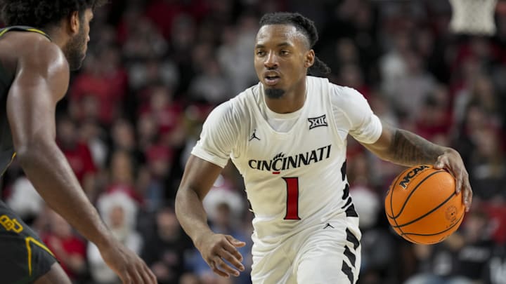 Feb 25, 2025; Cincinnati, Ohio, USA;  Cincinnati Bearcats guard Day Day Thomas (1) dribbles the ball against the Baylor Bears in the first half at Fifth Third Arena. Mandatory Credit: Aaron Doster-Imagn Images