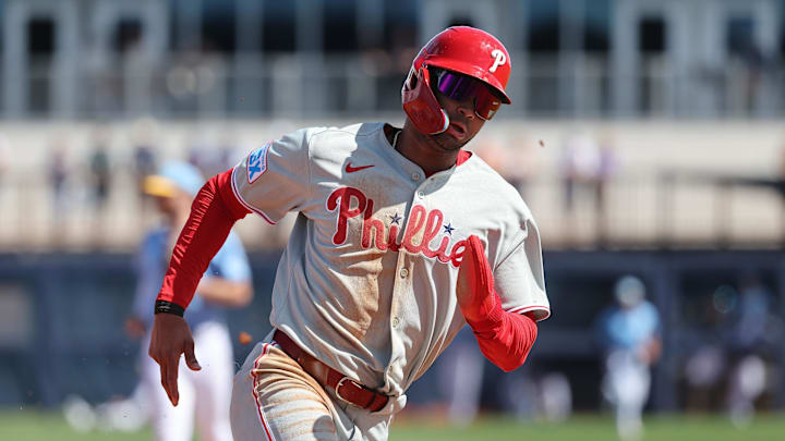 Feb 25, 2025; Port Charlotte, Florida, USA;  Philadelphia Phillies outfielder Justin Crawford (80) runs home to score against the Tampa Bay Rays during the fourth inning at Charlotte Sports Park.