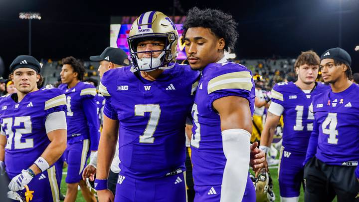 Huskies quarterback Elijah Brown (7) stands with cornerback Rahsjon Duncan (13) after losing to Iowa. Huskies quarterback Elijah Brown (7) stands with cornerback Rahsjon Duncan (13) after losing to Iowa.