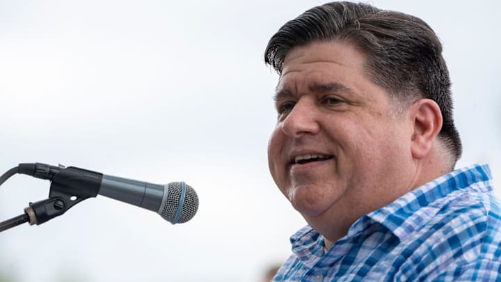 Gov. J.B. Pritzker speaking at the Polk County Democrats Steak Fry .