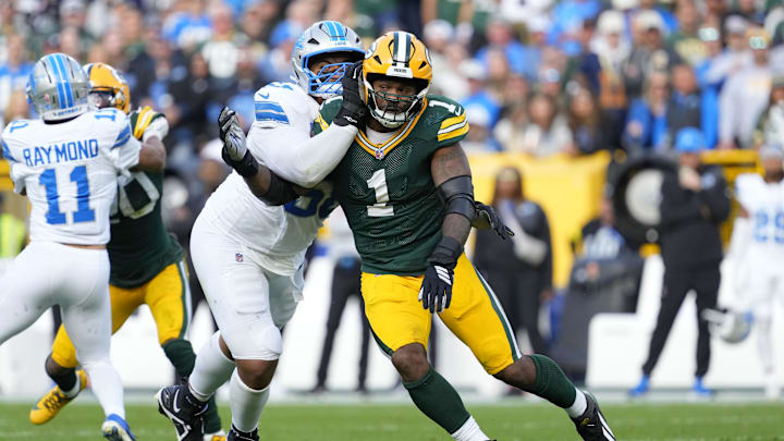 Sep 7, 2025; Green Bay, Wisconsin, USA; Detroit Lions offensive tackle Penei Sewell (58) tries to block Green Bay Packers defensive end Micah Parsons (1) during the second quarter at Lambeau Field. Mandatory Credit: Jeff Hanisch-Imagn Images