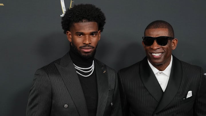 Feb 6, 2025; New Orleans, LA, USA;  Deion Sanders (right) with his son Shedeur Sanders on the red carpet before Super Bowl LIX NFL Honors at Saenger Theatre. Mandatory Credit: Kirby Lee-Imagn Images