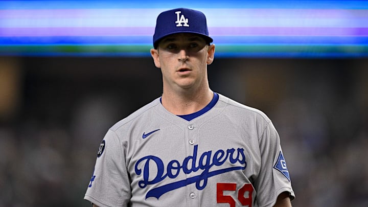 Apr 20, 2025; Arlington, Texas, USA; Los Angeles Dodgers relief pitcher Evan Phillips (59) comes off the field during the game between the Texas Rangers and the Los Angeles Dodgers at Globe Life Field. Mandatory Credit: Jerome Miron-Imagn Images