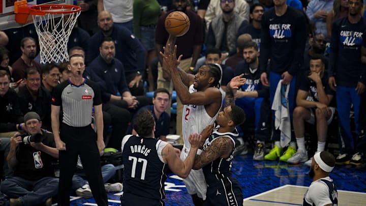 Apr 26, 2024; Dallas, Texas, USA; LA Clippers forward Kawhi Leonard (2) shoots the ball over Dallas