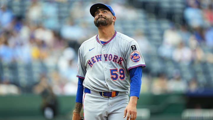 Jul 13, 2025; Kansas City, Missouri, USA; New York Mets starting pitcher Sean Manaea (59) reacts after being unable to field a ground ball during the eighth inning against the Kansas City Royals at Kauffman Stadium. Mandatory Credit: Jay Biggerstaff-Imagn Images
