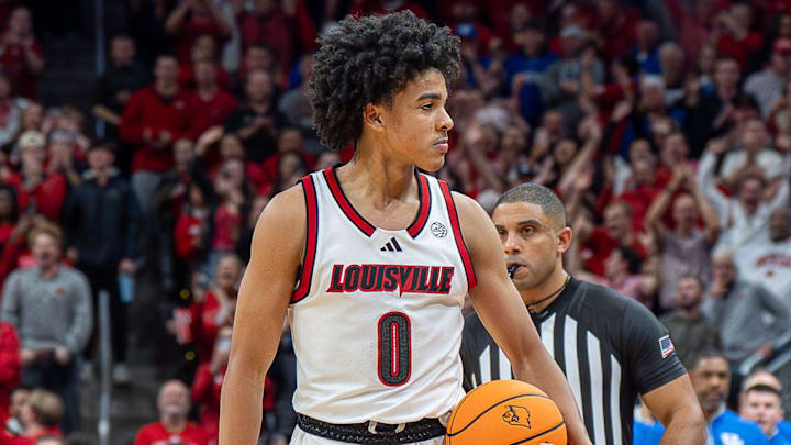 Louisville Cardinals guard Mikel Brown Jr. (0) looked to the crowd as time expired as the Louisville Cardinals hosted the Kentucky Wildcats at the KFC Yum! Center on Tuesday, Nov. 11, 2025. The Cardinals defeated the Wildcats 96-88. Louisville Cardinals guard Mikel Brown Jr. (0) looked to the crowd as time expired as the Louisville Cardinals hosted the Kentucky Wildcats at the KFC Yum! Center on Tuesday, Nov. 11, 2025. The Cardinals defeated the Wildcats 96-88.