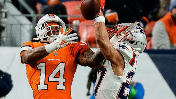 Dec 24, 2023; Denver, Colorado, USA; New England Patriots cornerback Myles Bryant (27) deflects a pass intended for Denver Broncos wide receiver Courtland Sutton (14) in the first quarter at Empower Field at Mile High. Mandatory Credit: Isaiah J. Downing-USA TODAY Sports