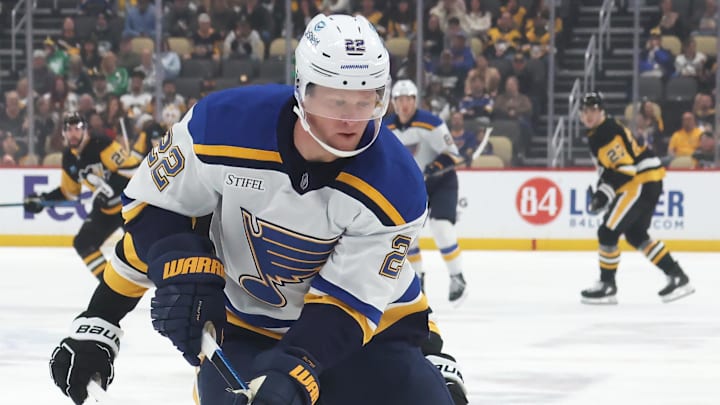 Mar 13, 2025; Pittsburgh, Pennsylvania, USA; St. Louis Blues defenseman Ryan Suter (22) handles the puck against the Pittsburgh Penguins during the first period at PPG Paints Arena. Mandatory Credit: Charles LeClaire-Imagn Images