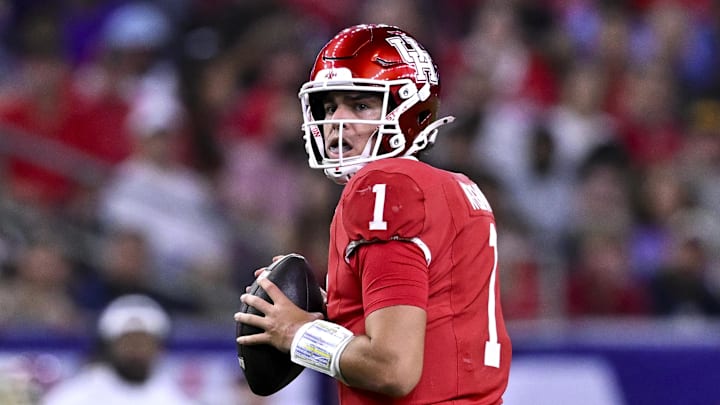 Dec 27, 2025; Houston, TX, USA; Houston Cougars quarterback Conner Weigman (1) looks to pass the ball during the first half against the Louisiana State Tigers at NRG Stadium. Mandatory Credit: Maria Lysaker-Imagn Images 