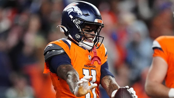 Dec 14, 2025; Denver, Colorado, USA; Denver Broncos wide receiver Troy Franklin (11) celebrates a touchdown during the third quarter against the Green Bay Packers at Empower Field at Mile High. 