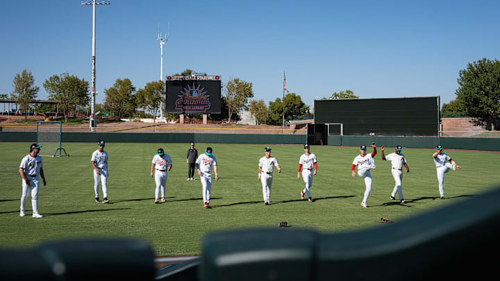 Players warm up for batting practice at Arizona Fall League media day at Scottsdale Stadium during media day on Oct. 4, 2024, in Scottsdale, Arizona.