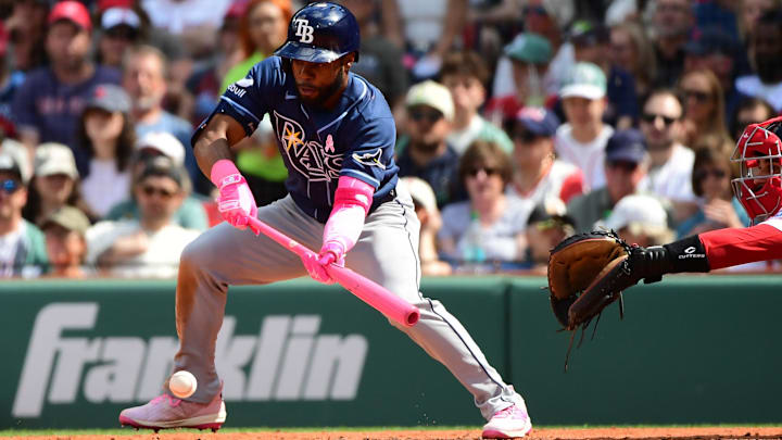 May 10, 2026; Boston, Massachusetts, USA;  Tampa Bay Rays center fielder Cedric Mullins (31) hits a sacrifice bunt during the sixth inning against the Boston Red Sox at Fenway Park.