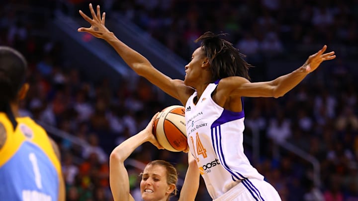 Sep 7, 2014; Phoenix, AZ, USA; Chicago Sky guard Allie Quigley (left) looks to pass the ball under pressure from Phoenix Mercury guard DeWanna Bonner during game one of the WNBA Finals at US Airways Center. The Mercury defeated the Sky 83-62. Mandatory Credit: Mark J. Rebilas-Imagn Images