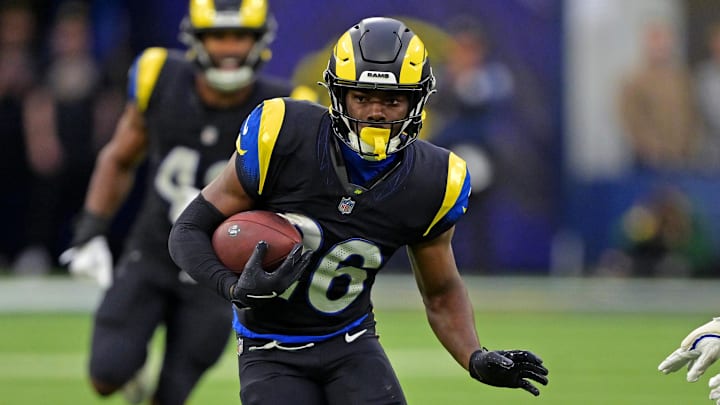 Rams safety Kamren Kinchens runs the ball after an interception against the Seahawks.