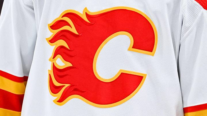 Dec 12, 2022; Montreal, Quebec, CAN; View of a Calgary Flames logo on a jersey worn by the member of the team during the second period at Bell Centre. Mandatory Credit: David Kirouac-Imagn Images