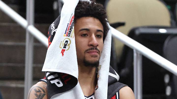 Mar 15, 2026; Pittsburgh, PA, USA; Dayton Flyers guard Javon Bennett (0) looks on as the VCU Rams cut down the nets after defeating Dayton to win the Atlantic 10 Conference Tournament Championship game at PPG Paints Arena. Mar 15, 2026; Pittsburgh, PA, USA; Dayton Flyers guard Javon Bennett (0) looks on as the VCU Rams cut down the nets after defeating Dayton to win the Atlantic 10 Conference Tournament Championship game at PPG Paints Arena.