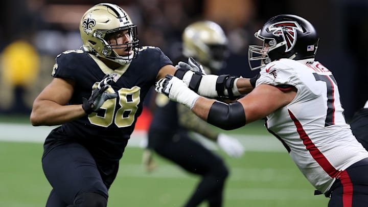 Nov 7, 2021; New Orleans, Louisiana, USA; New Orleans Saints defensive end Payton Turner (98) is blocked by Atlanta Falcons offensive tackle Jake Matthews (70) during the second quarter at the Caesars Superdome. 