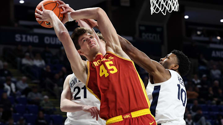 Feb 8, 2026; University Park, Pennsylvania, USA; Southern California Trojans center Gabe Dynes (45) and Penn State Nittany Lions forward Josh Reed (10) fight for the ball during the second half at Bryce Jordan Center. Mandatory Credit: Matthew O'Haren-Imagn Images