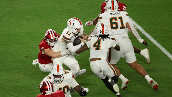 Jan 19, 2026; Miami Gardens, FL, USA; Indiana Hoosiers linebacker Aiden Fisher (4) sacks Miami Hurricanes quarterback Carson Beck (11) in the first quarter during the College Football Playoff National Championship game at Hard Rock Stadium. Mandatory Credit: Kim Klement Neitzel-Imagn Images