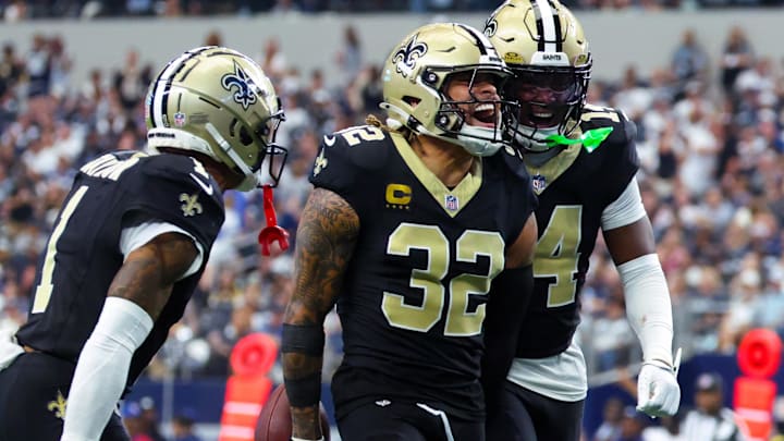 Sep 15, 2024; Arlington, Texas, USA; New Orleans Saints safety Tyrann Mathieu (32) celebrates with New Orleans Saints cornerback Alontae Taylor (1) and New Orleans Saints cornerback Kool-Aid McInstry(14) after making an interception during the second half against the Dallas Cowboys at AT&T Stadium. Mandatory Credit: Kevin Jairaj-Imagn Images