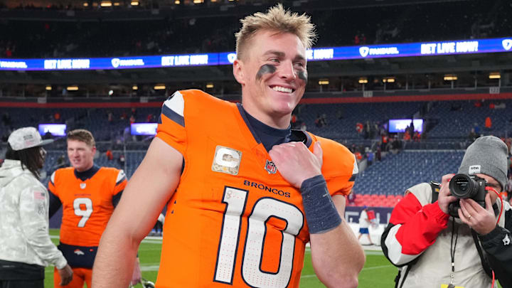 Nov 17, 2024; Denver, Colorado, USA; Denver Broncos quarterback Bo Nix (10) reacts following the win over the Atlanta Falcons at Empower Field at Mile High. 